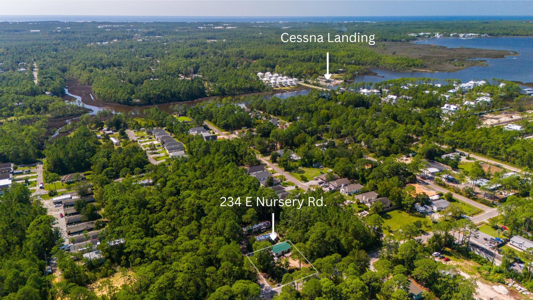 234 East Nursery Road Santa Rosa Beach, FL 32459 - Photo 1 of 4 a view of a lake with a houses