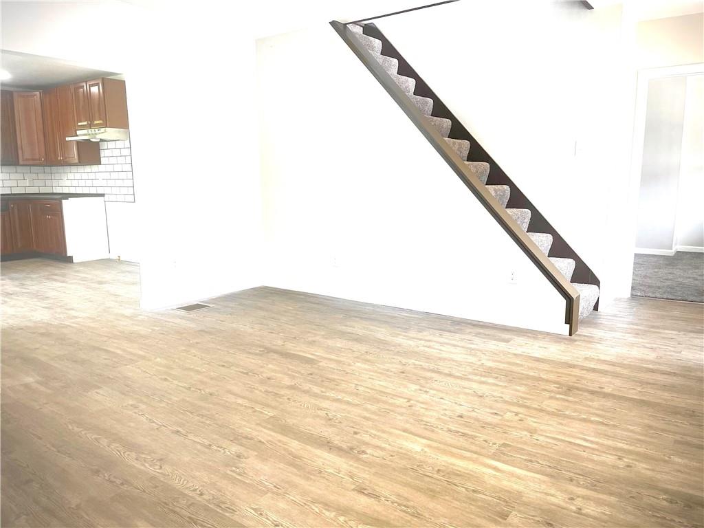 725 West Main Street Rural Valley, PA 16249 - Photo 15 of 35 a view of a room with kitchen and wooden floor