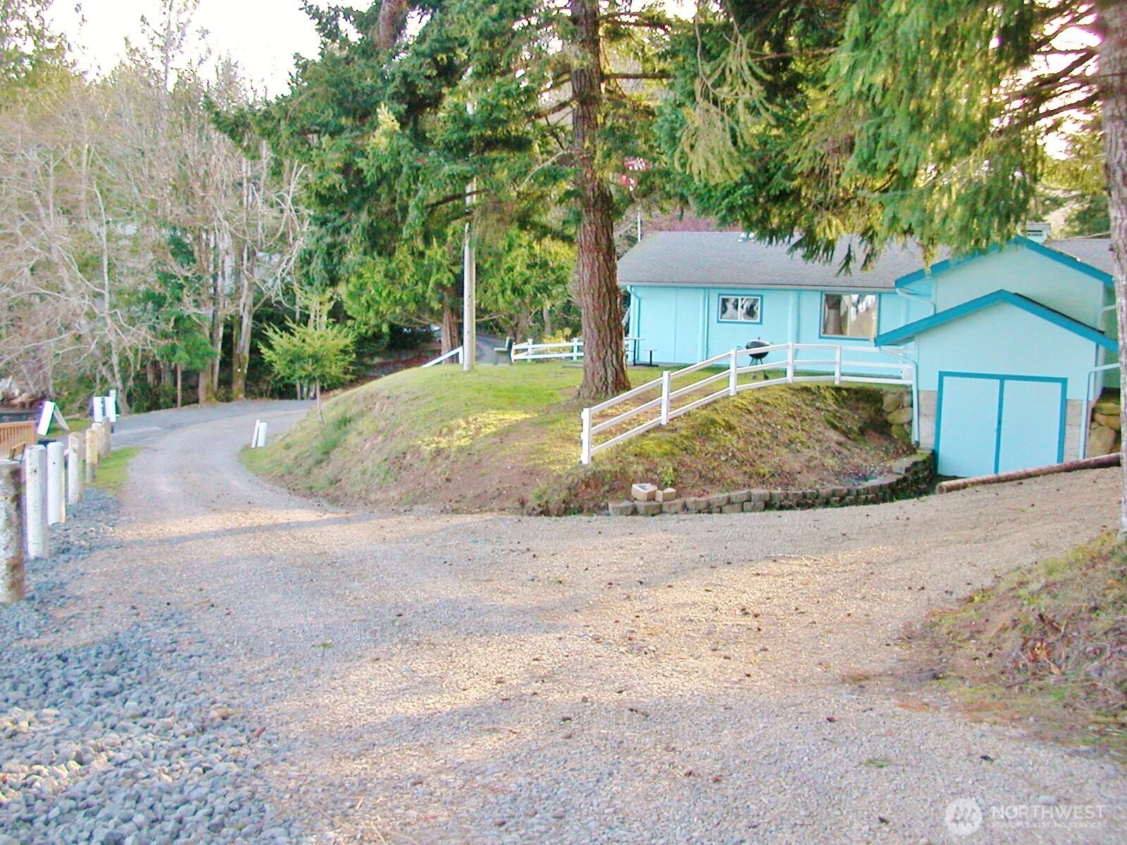 170 Kelly Road Brinnon, WA 98320 - Photo 28 of 29 a front view of a house with a yard and garage