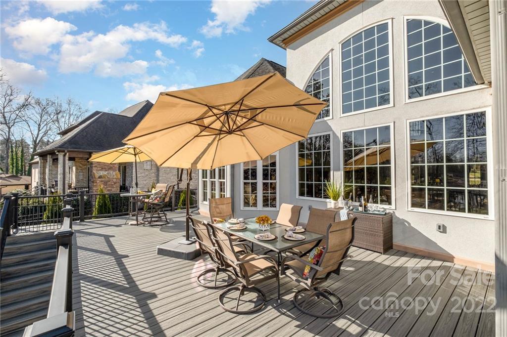 3210 Lake Shore Road South Denver, NC 28037 - Photo 13 of 44 a view of a dinning table and chairs in patio of the house