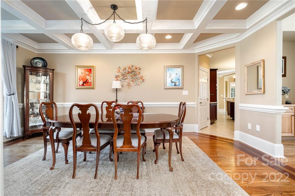 3210 Lake Shore Road South Denver, NC 28037 - Photo 28 of 44 a view of a dining room with furniture wooden floor and chandelier