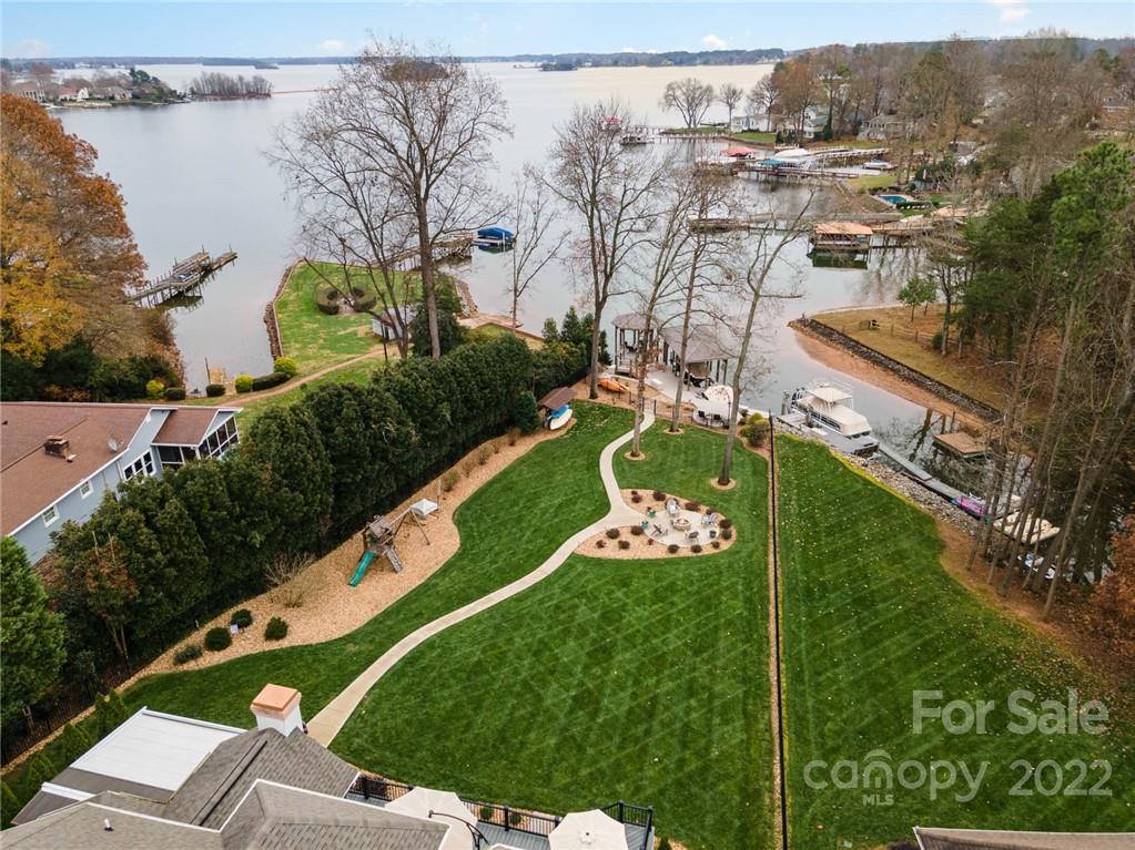 3210 Lake Shore Road South Denver, NC 28037 - Photo 5 of 44 a view of a swimming pool and outdoor seating