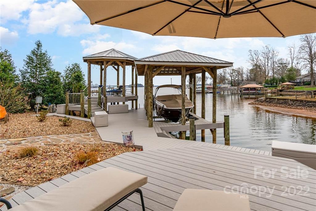 3210 Lake Shore Road South Denver, NC 28037 - Photo 7 of 44 a view of a dinning table and chairs in the patio
