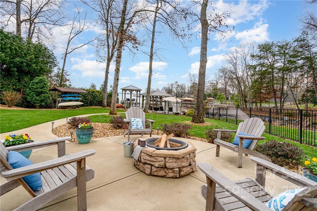 3210 Lake Shore Road South Denver, NC 28037 - Photo 8 of 44 a view of a patio with couches chairs and a fire pit