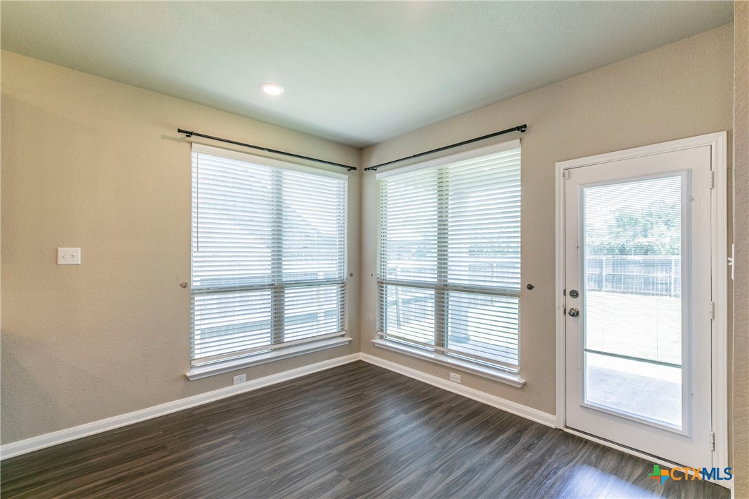 1616 Crooked Tree Temple, TX 76502 - Photo 8 of 22 a view of wooden floor and windows in a room