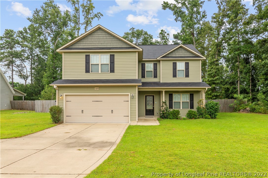 3479 Thrower Road Hope Mills, NC 28348 - Photo 1 of 41 a front view of a house with yard and garage