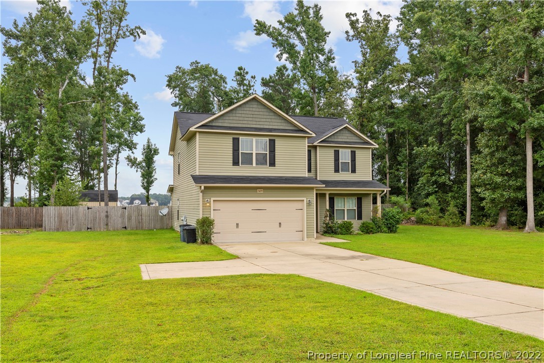 3479 Thrower Road Hope Mills, NC 28348 - Photo 2 of 41 a front view of a house with a yard
