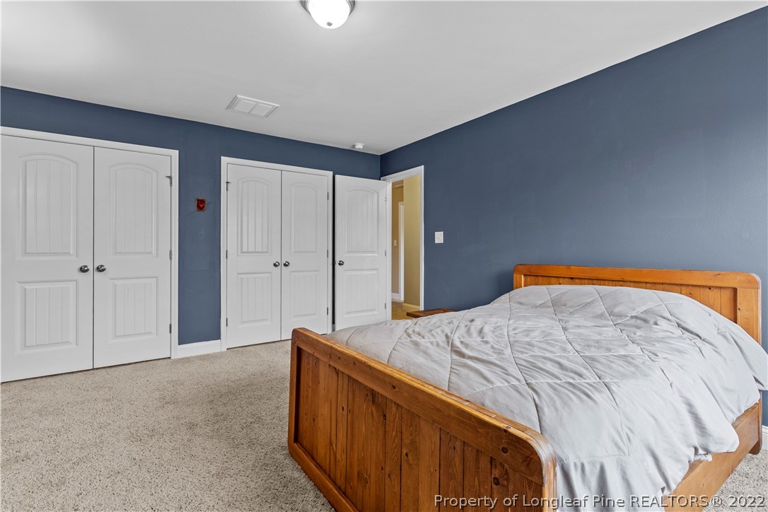 3479 Thrower Road Hope Mills, NC 28348 - Photo 25 of 41 a bedroom with a bed and closet