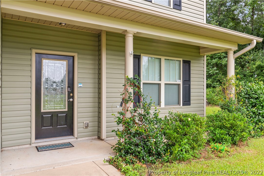 3479 Thrower Road Hope Mills, NC 28348 - Photo 5 of 41 a view of a house with potted plants