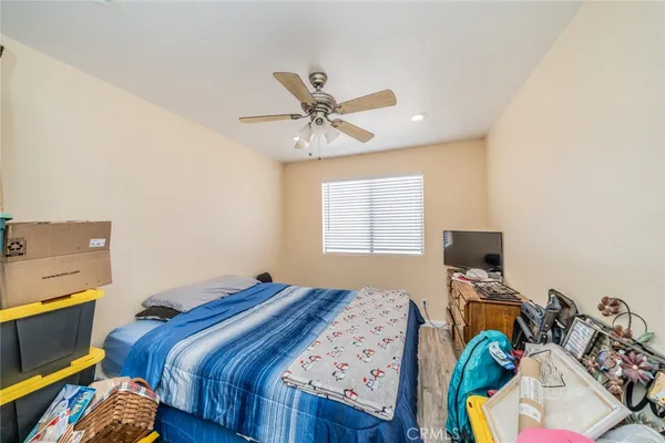 a bed room with a bed and a tv