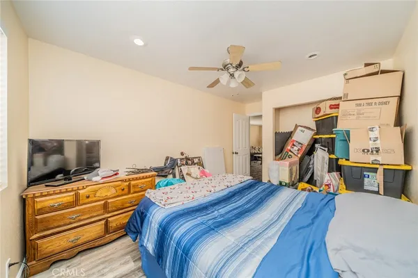 a bed room with furniture and a baby crib
