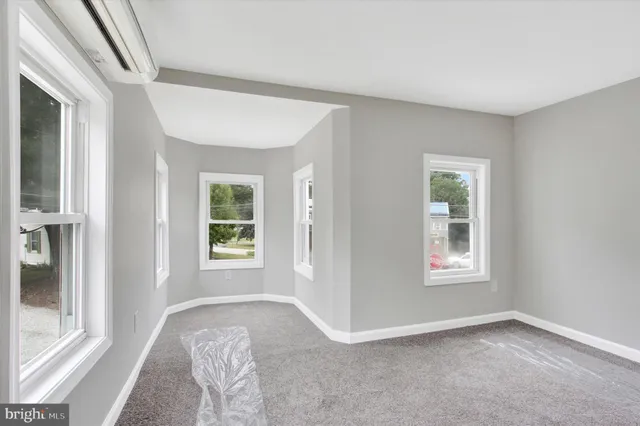 a view of livingroom with hardwood floor and hallway