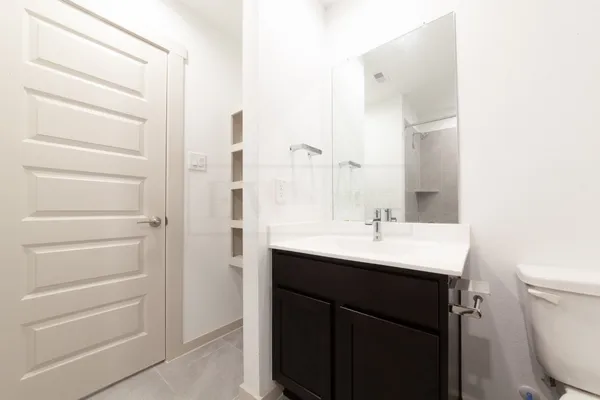 a view of a bedroom from a hallway