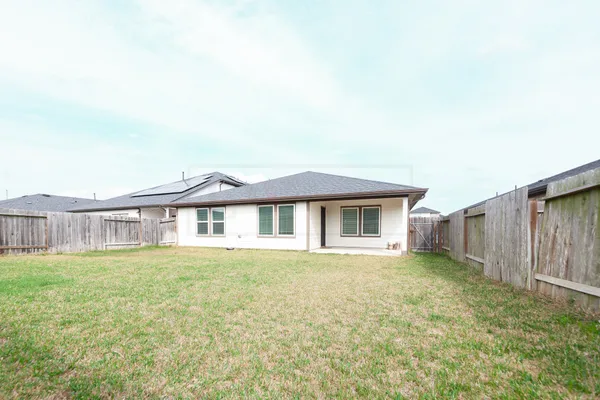 a house view with a garden space
