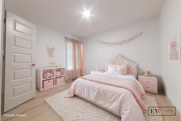 a bedroom with a bed and a cabinets