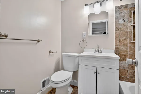 a bathroom with a bathtub and shower