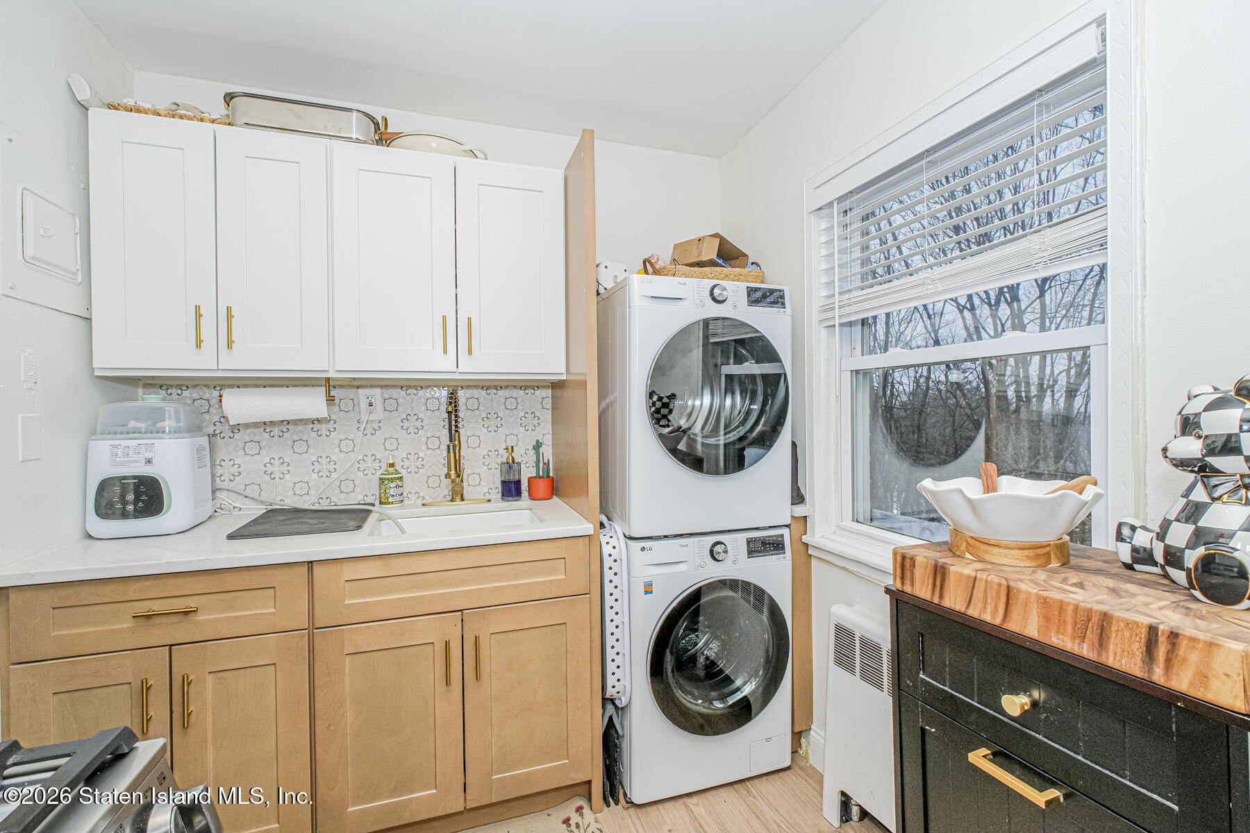 167 Arlo Road, Unit B Staten Island, NY 10301 - Photo 7 of 12 a utility room with sink dryer and washer