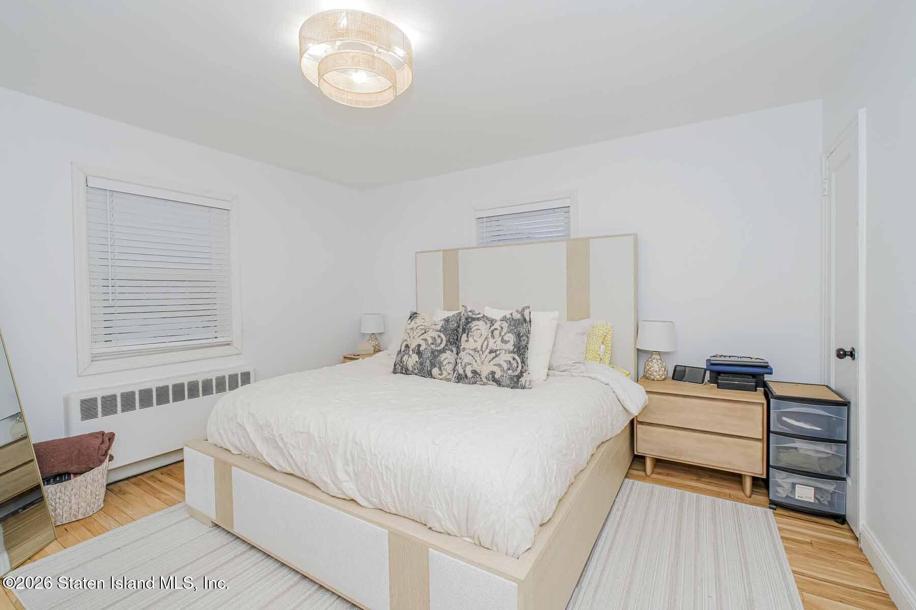 167 Arlo Road, Unit B Staten Island, NY 10301 - Photo 10 of 12 a bedroom with a bed and a window