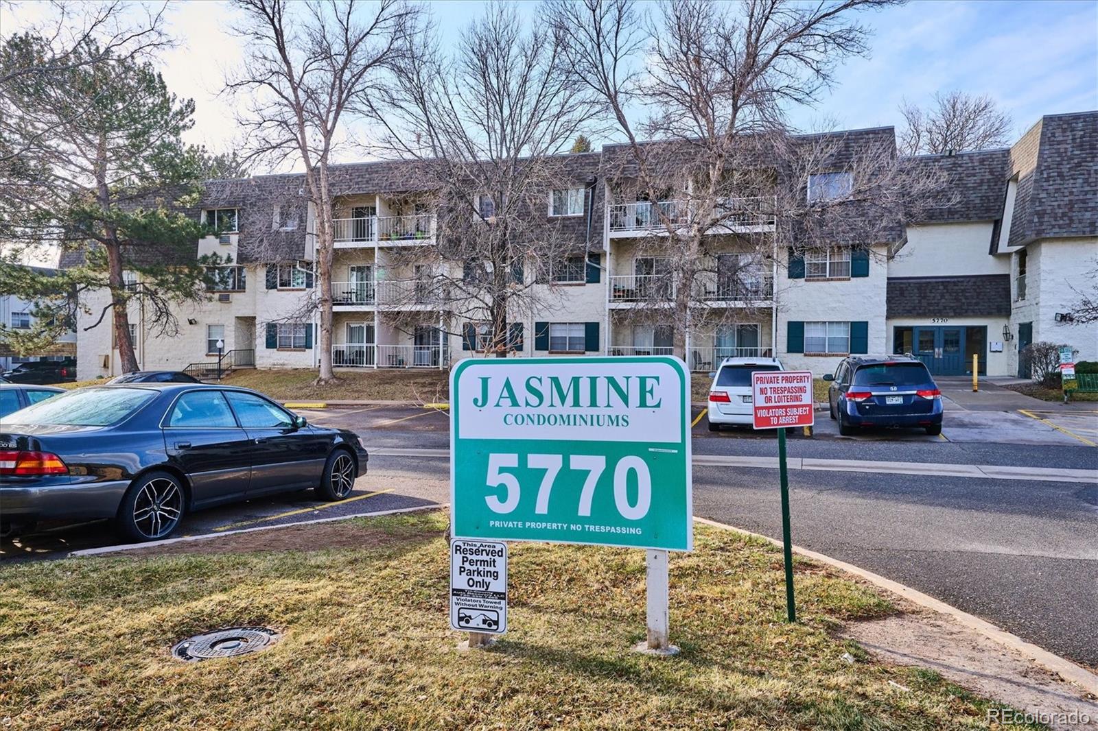 5770 East Warren Avenue, Unit 305 Denver, CO 80222 - Photo 15 of 24 a car parked in front of a building