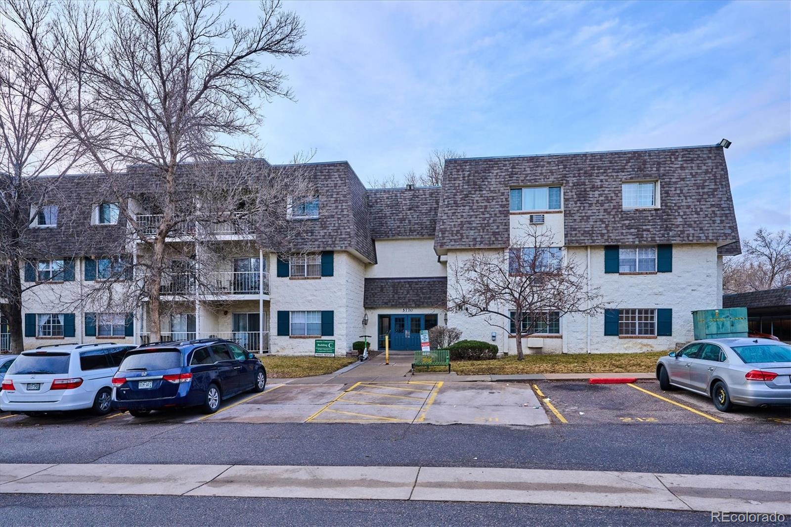 5770 East Warren Avenue, Unit 305 Denver, CO 80222 - Photo 16 of 24 a front view of building with cars parked