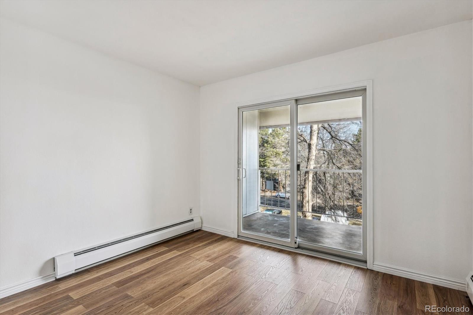 5770 East Warren Avenue, Unit 305 Denver, CO 80222 - Photo 10 of 24 a view of wooden floor in a room