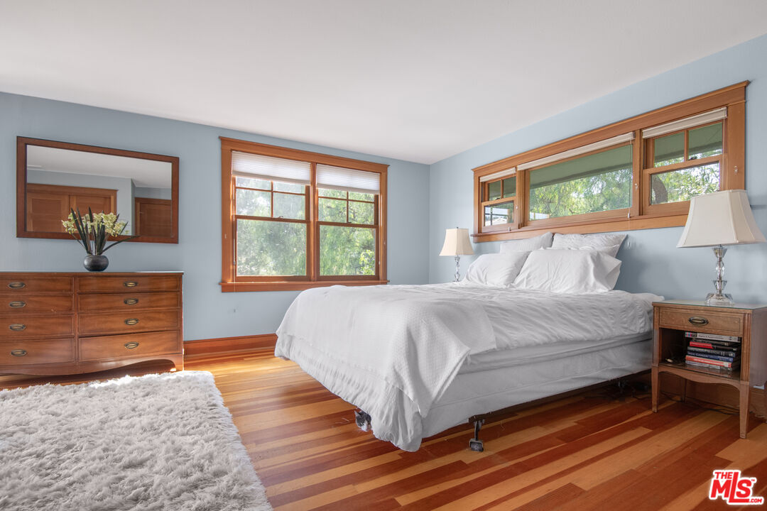33208 Decker School Road Malibu, CA 90265 - Photo 17 of 51 a bedroom with a bed and window