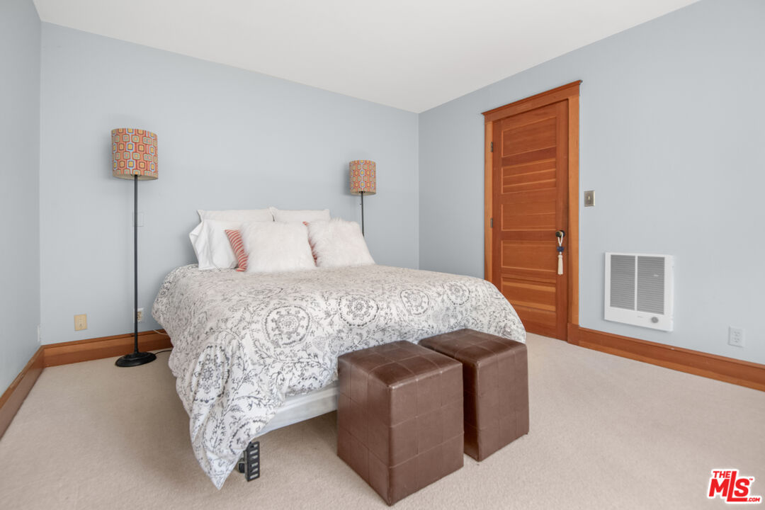 33208 Decker School Road Malibu, CA 90265 - Photo 26 of 51 a bedroom with a bed and a cabinets