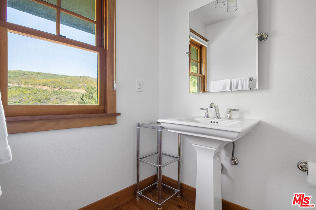 33208 Decker School Road Malibu, CA 90265 - Photo 29 of 51 a bathroom with a sink and a window