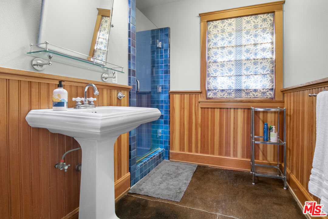 33208 Decker School Road Malibu, CA 90265 - Photo 31 of 51 a bathroom with a sink a mirror and a shower