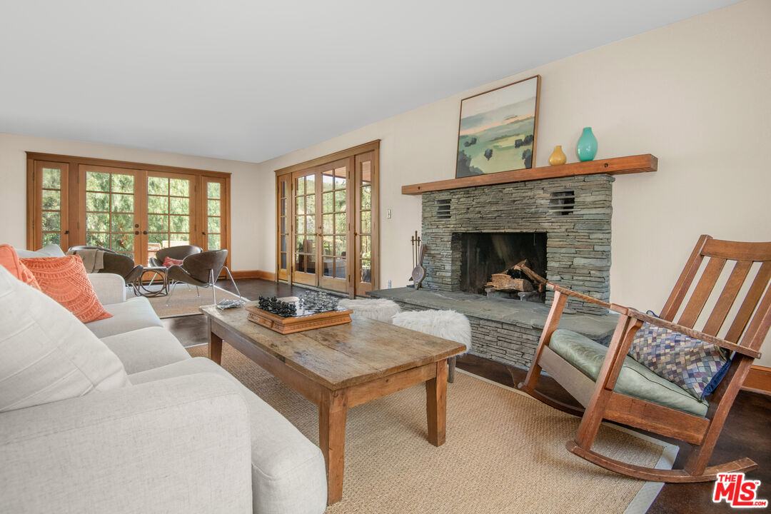 33208 Decker School Road Malibu, CA 90265 - Photo 5 of 51 a living room with furniture and a fireplace