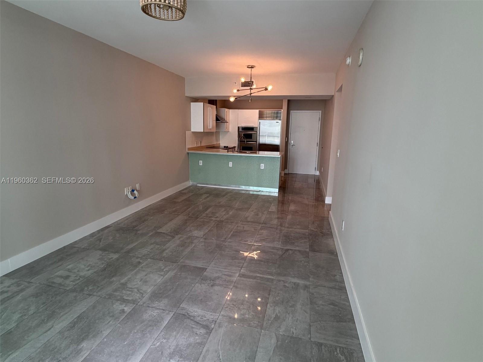218 Southeast 14th Street, Unit 1406 Miami, FL 33131 - Photo 3 of 8 a view of a kitchen with a sink