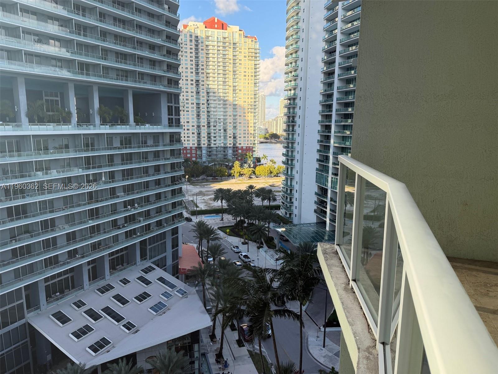 218 Southeast 14th Street, Unit 1406 Miami, FL 33131 - Photo 8 of 8 a view of a balcony with chairs