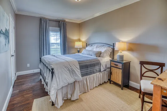 a view of a lake with houses in the back