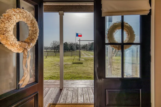 a living room with furniture and windows