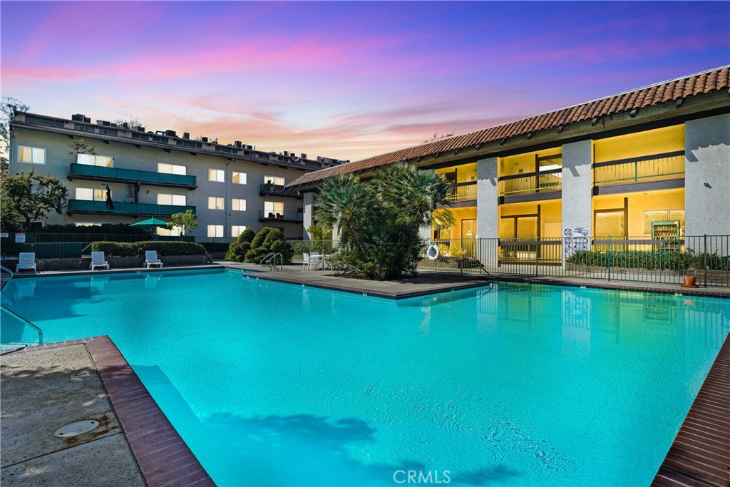 5460 White Oak Avenue, Unit G213 Encino, CA 91316 - Photo 1 of 22 a view of swimming pool with outdoor seating