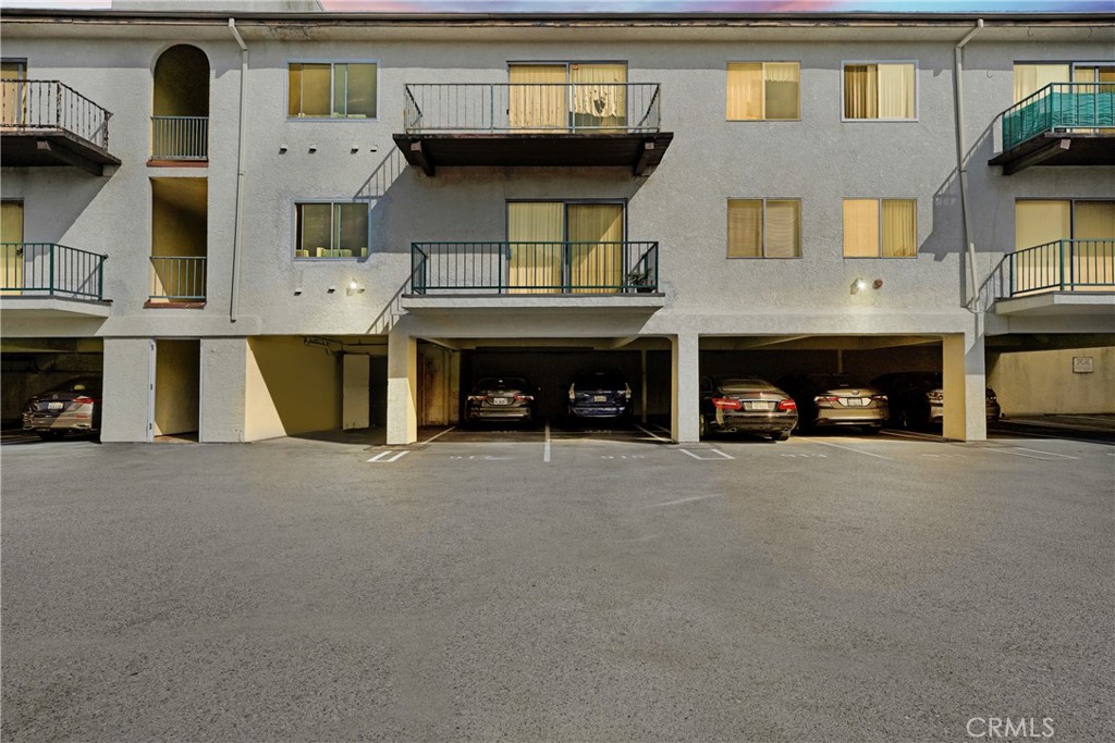5460 White Oak Avenue, Unit G213 Encino, CA 91316 - Photo 13 of 22 a view of a car parked in front of a building