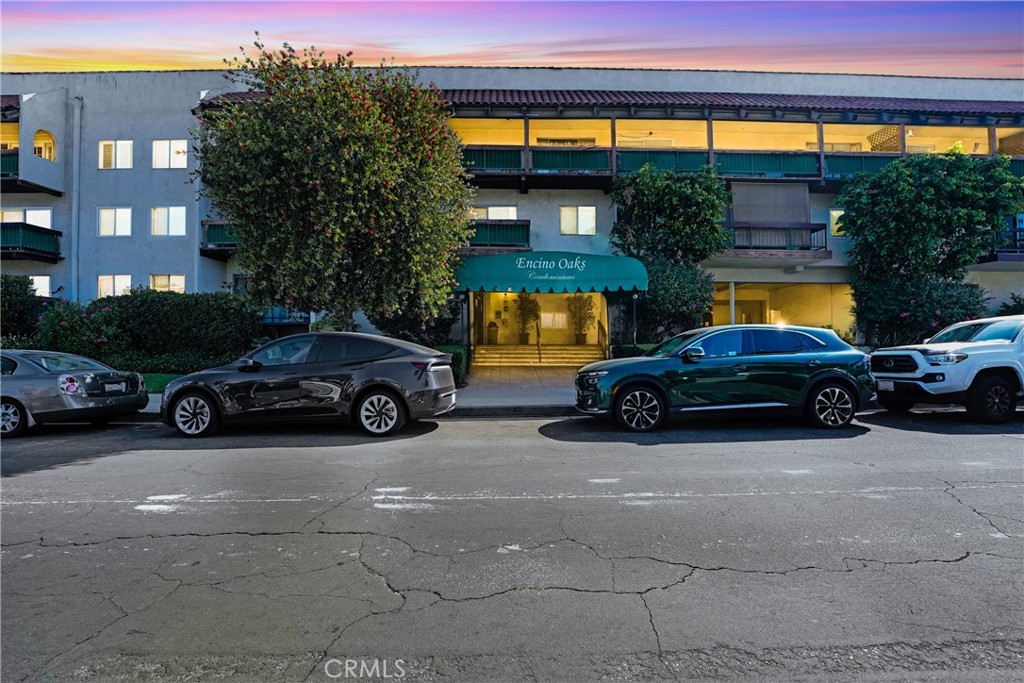 5460 White Oak Avenue, Unit G213 Encino, CA 91316 - Photo 22 of 22 a view of a car parked in front of a building