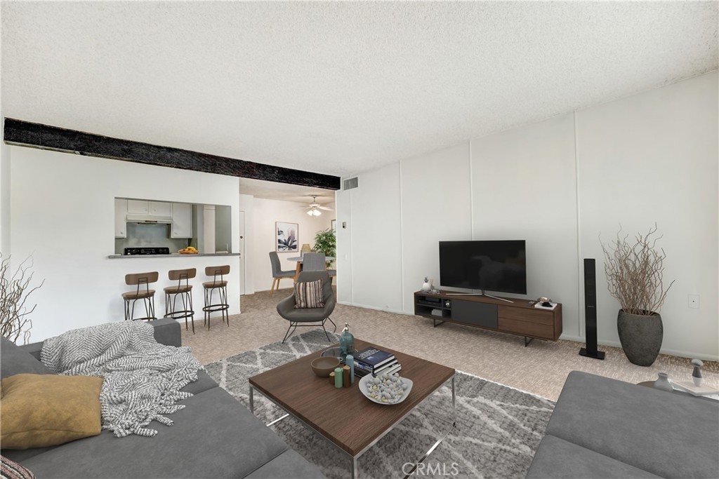 5460 White Oak Avenue, Unit G213 Encino, CA 91316 - Photo 4 of 22 a living room with furniture and a flat screen tv