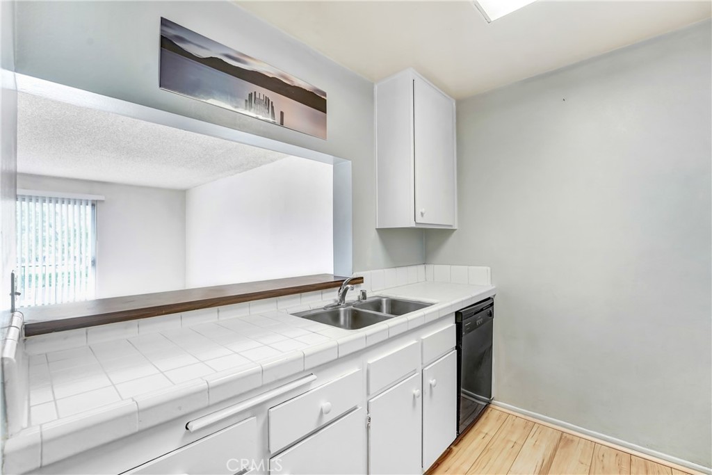 5460 White Oak Avenue, Unit G213 Encino, CA 91316 - Photo 6 of 22 a kitchen with a sink and cabinets