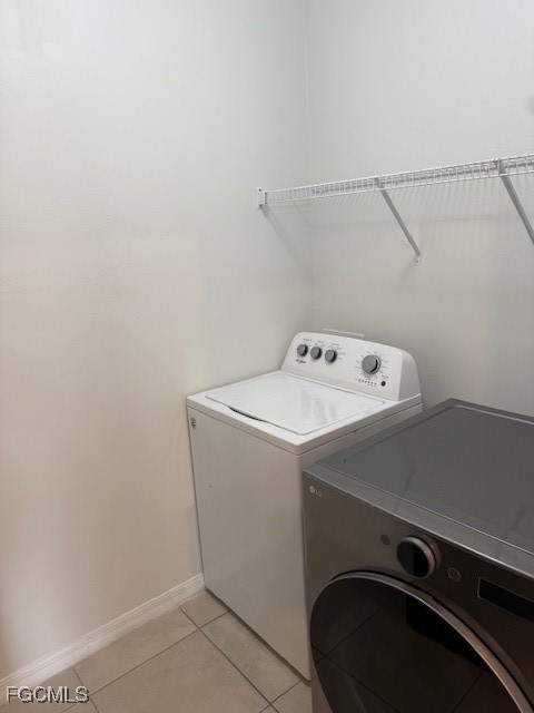8046 Gopher Tortoise Trail Lehigh Acres, FL 33972 - Photo 13 of 18 a utility room with dryer and washer