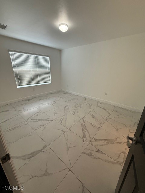8046 Gopher Tortoise Trail Lehigh Acres, FL 33972 - Photo 4 of 18 an empty room with windows