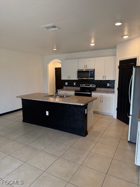 8046 Gopher Tortoise Trail Lehigh Acres, FL 33972 - Photo 10 of 18 a kitchen with stainless steel appliances granite countertop a stove a sink and a refrigerator