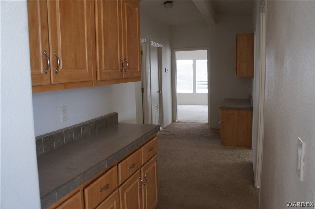 3233 West Rancho Road Golden Valley, AZ 86413 - Photo 20 of 33 a kitchen with a sink and cabinets