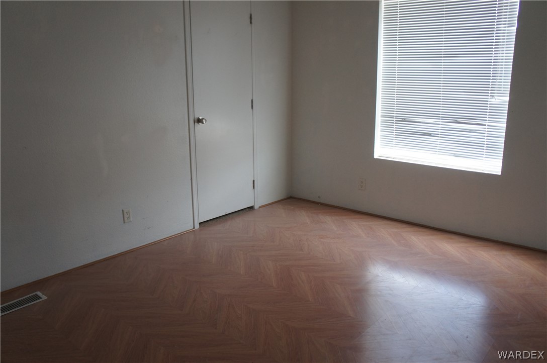 3233 West Rancho Road Golden Valley, AZ 86413 - Photo 22 of 33 a view of an empty room with a window