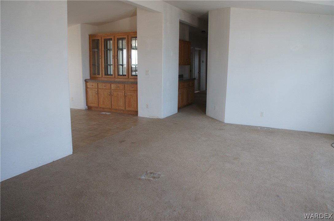 3233 West Rancho Road Golden Valley, AZ 86413 - Photo 8 of 33 an empty room with windows