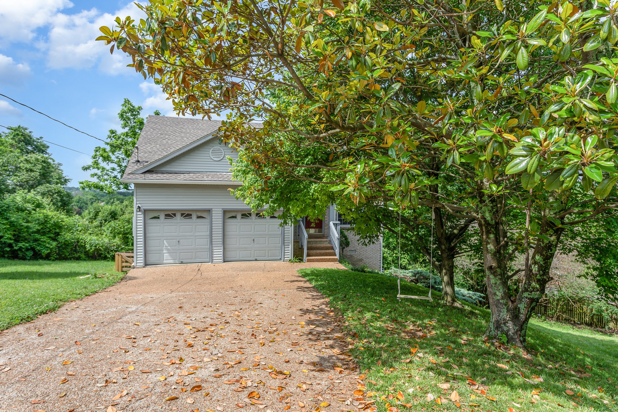 5336 Old Village Road Nashville, TN 37211 - Photo 5 of 25 a front view of a house with a garden