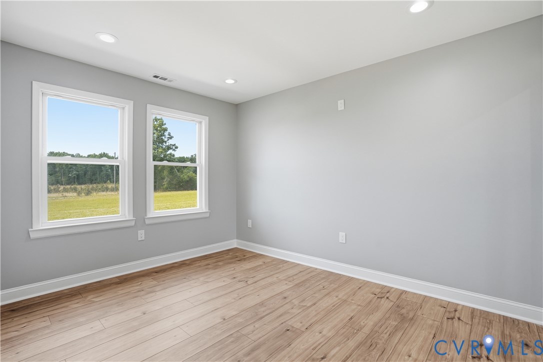 7839 King William Road Aylett, VA 23009 - Photo 26 of 38 an empty room with wooden floor and windows