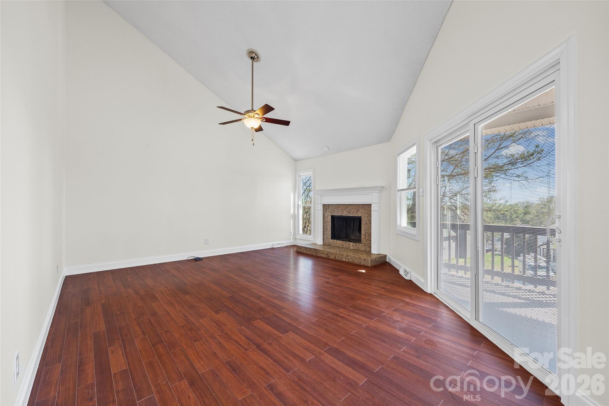 16149 Haroa Court Fort Mill, SC 29708 - Photo 10 of 43 a view of empty room with wooden floor and fan