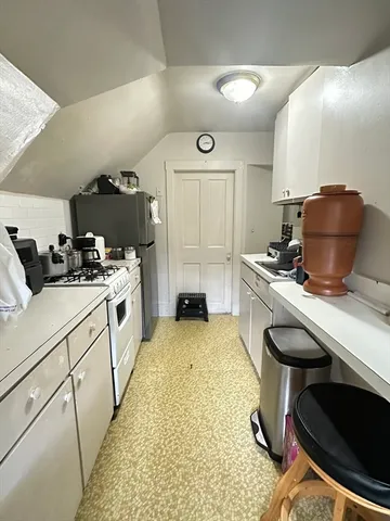 a kitchen with sink cabinets and stove