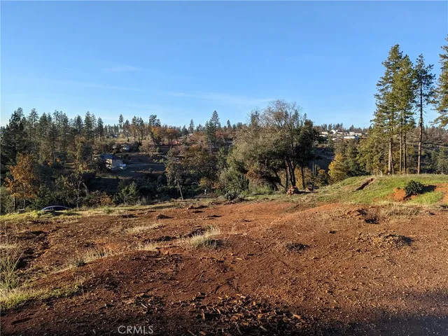 a view of a backyard with swimming pool